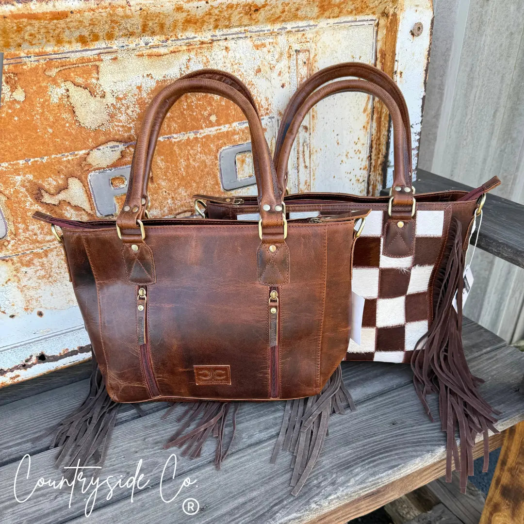 Brown leather and cowhide checkered tote bag with fringe