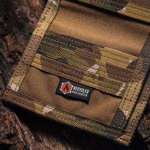 Bifold wallet made from multi-cam camouflage fire hose material with Recycled Firefighter logo.