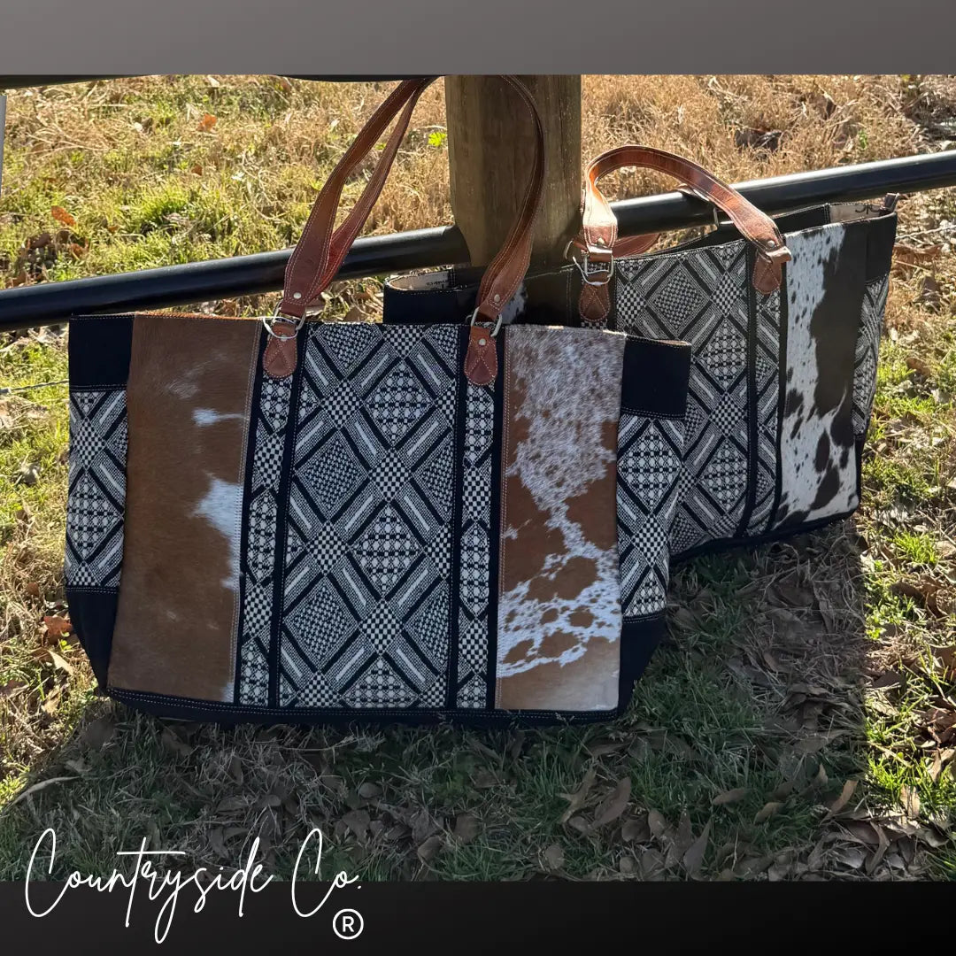  Charlene Cowhide Weekender Bag with geometric textile and leather handles.