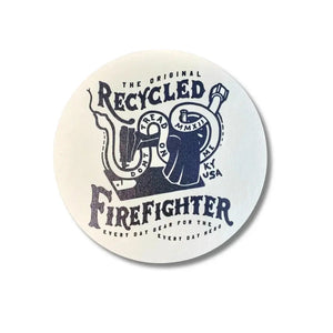 Round coaster with navy blue firefighter emblem and text MMXII KY USA.