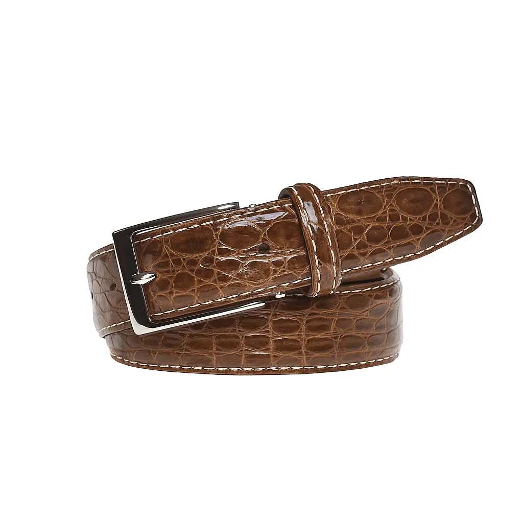 Close up of cognac caiman crocodile leather belt texture