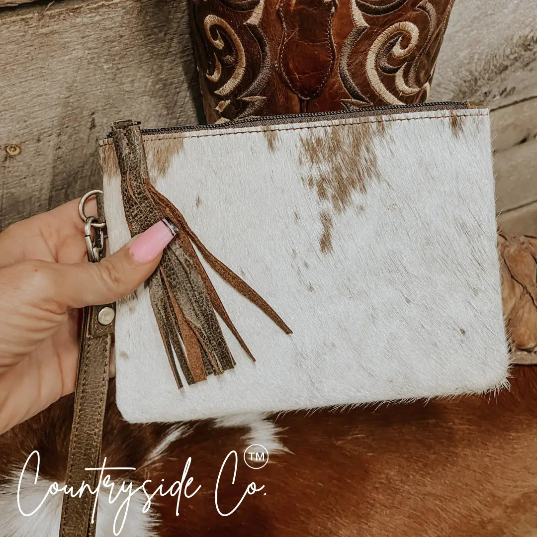 White and brown cowhide wristlet with leather trim by Countryside Co.