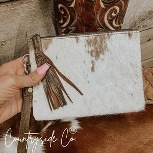 White and brown cowhide wristlet with leather trim by Countryside Co.