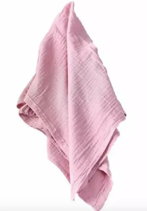 Pink crinkle cloth napkin with textured surface.