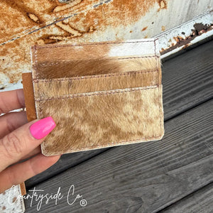 Brown and white cowhide credit card holder with multiple slots, Countryside Co. watermark.