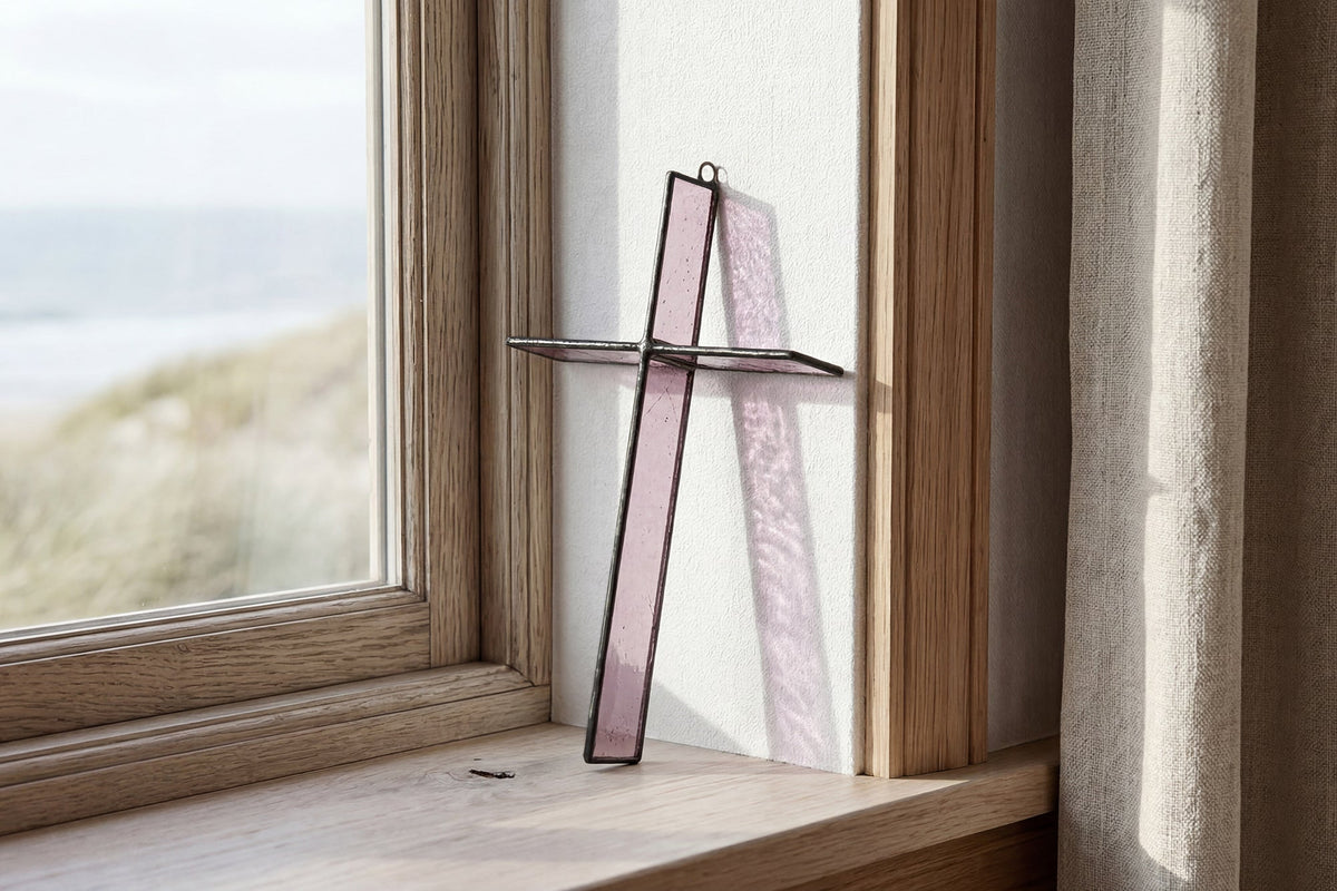 Light passing through Evening Plum Cross Suncatcher by Greyhouse Glass