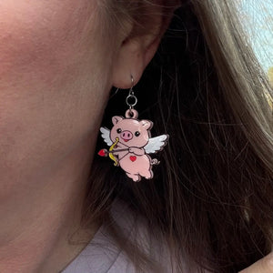 Cupid Pig Earrings: Hand-Painted Acrylic Valentine's Day Jewelry by Poor Hog Customs. Cute Pig Angel Earring. Wearing Pig Earring on Ear
