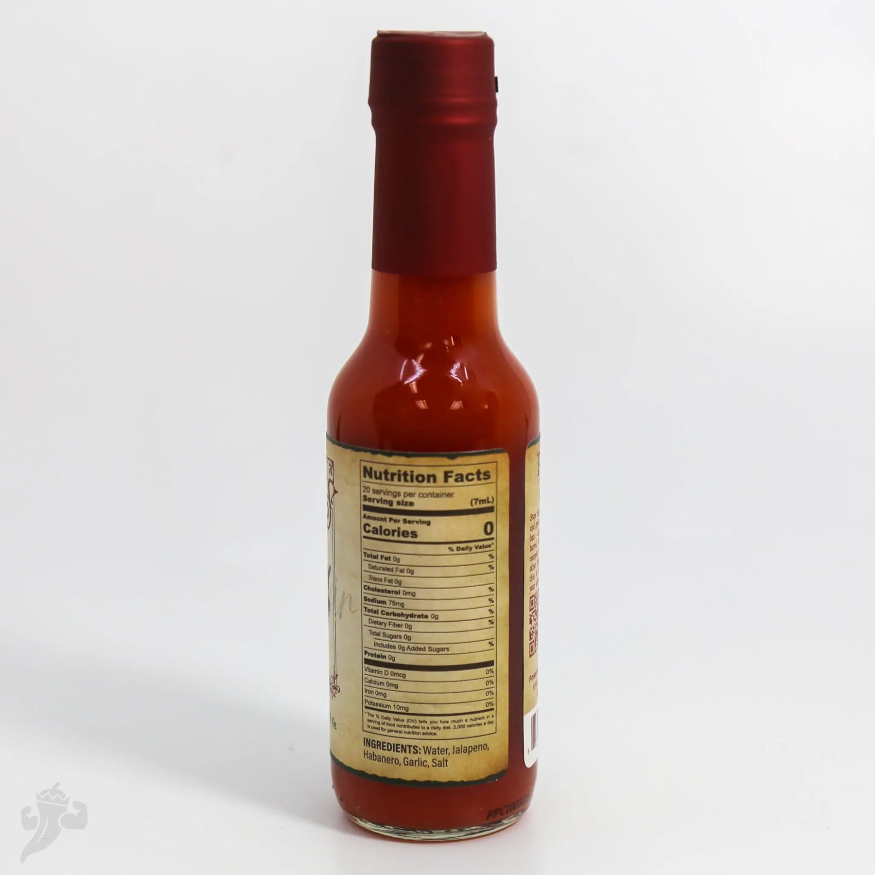 Dr. Gleaton's Chili Elixir hot sauce bottle with nutrition facts label.