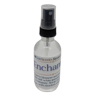 Enchanted Room Spray by NonScents: Clear bottle with black spray nozzle and floral scent label.