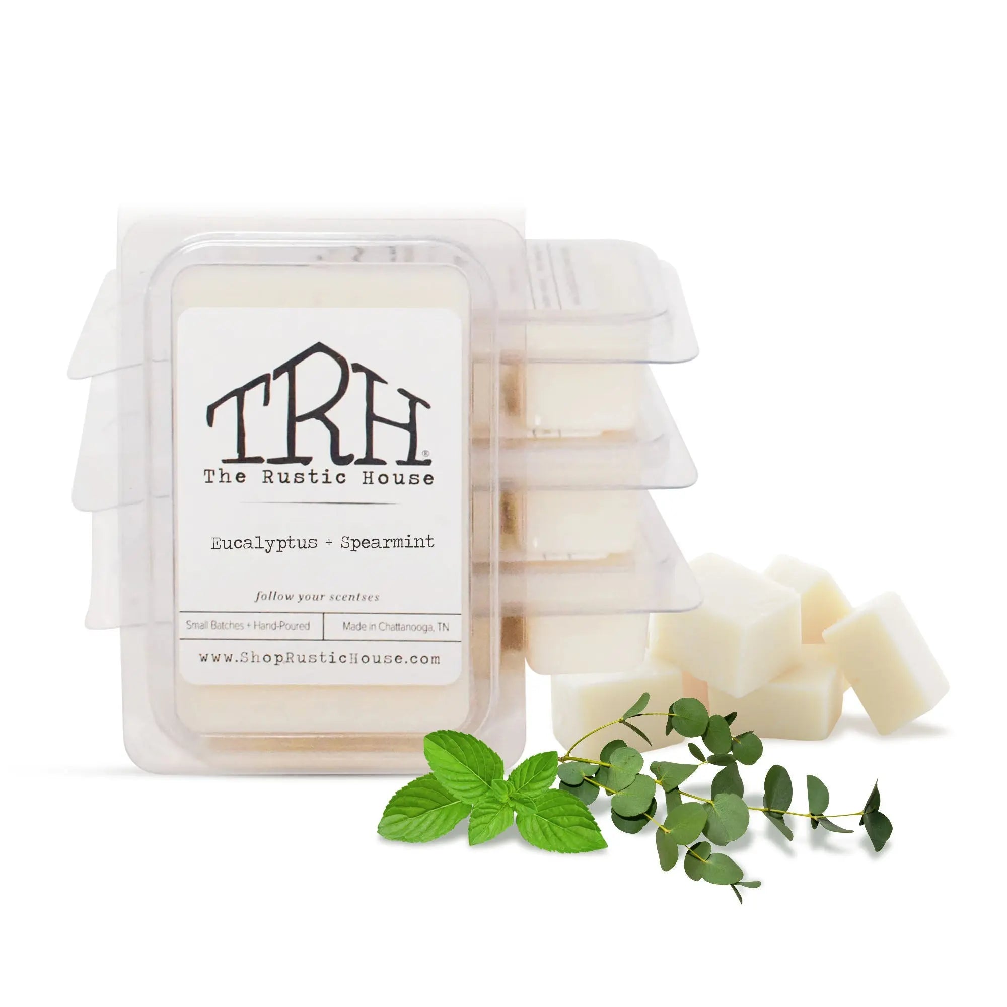 The Rustic House Eucalyptus + Spearmint wax melt with mint and eucalyptus sprigs.