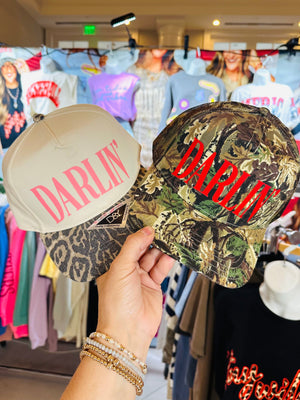 Darlin' (red font) Real Camo Canvas Trucker Hat detail view by Southern Bliss Company