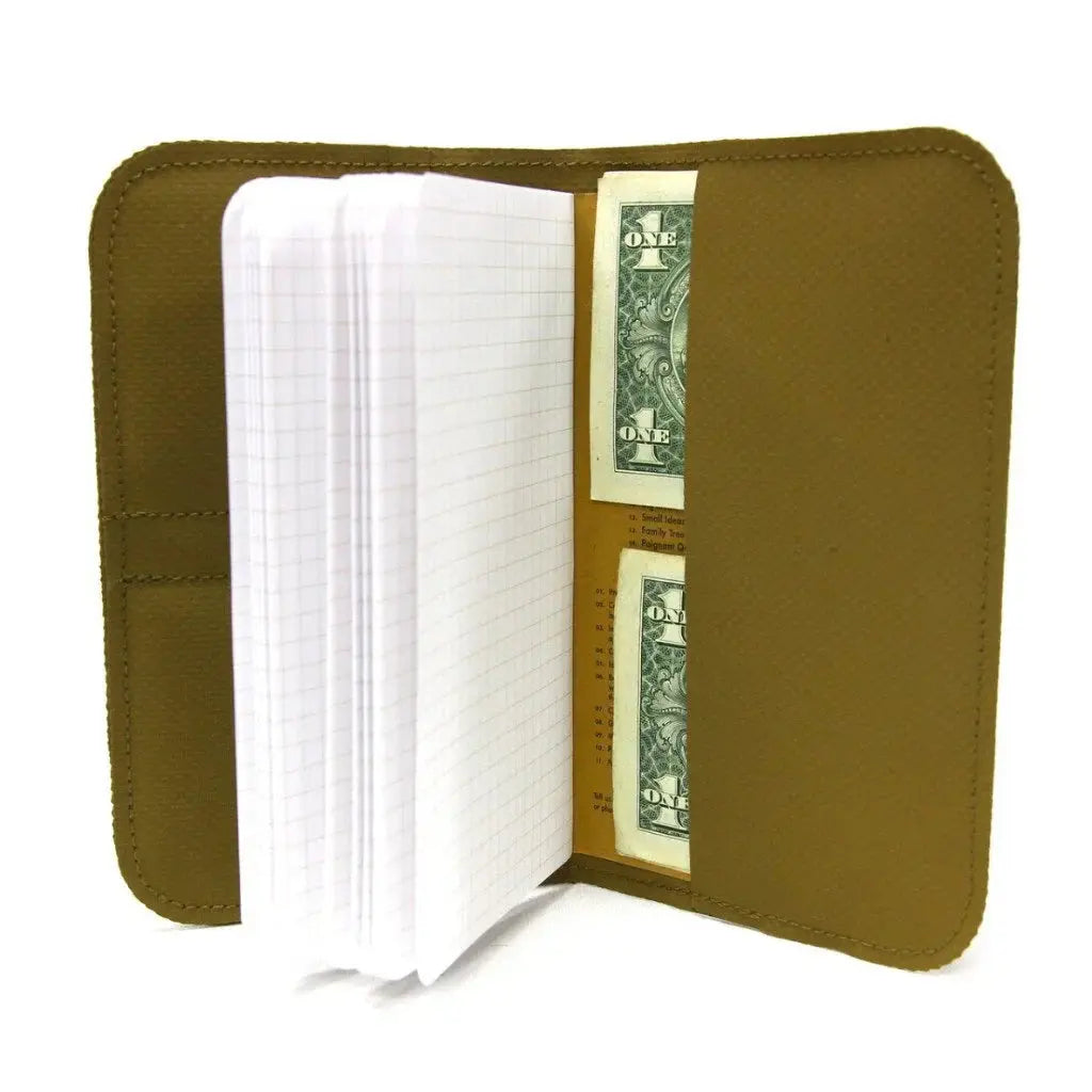 Brown leather-like wallet with open Field Notes notebook and dollar bills