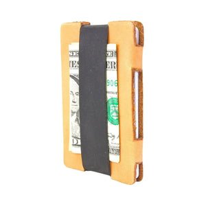 Full grain leather card wallet with black elastic band and US dollar bills.