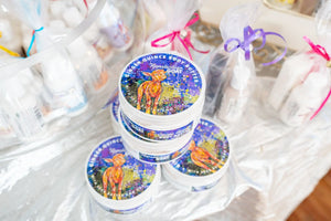 Appalachian Goat Ginger Quince Body Butter tubs stacked and wrapped with ribbons.