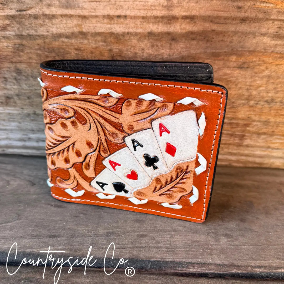 Leather men's wallet with hand-tooled design and painted ace of spades, hearts, and diamonds