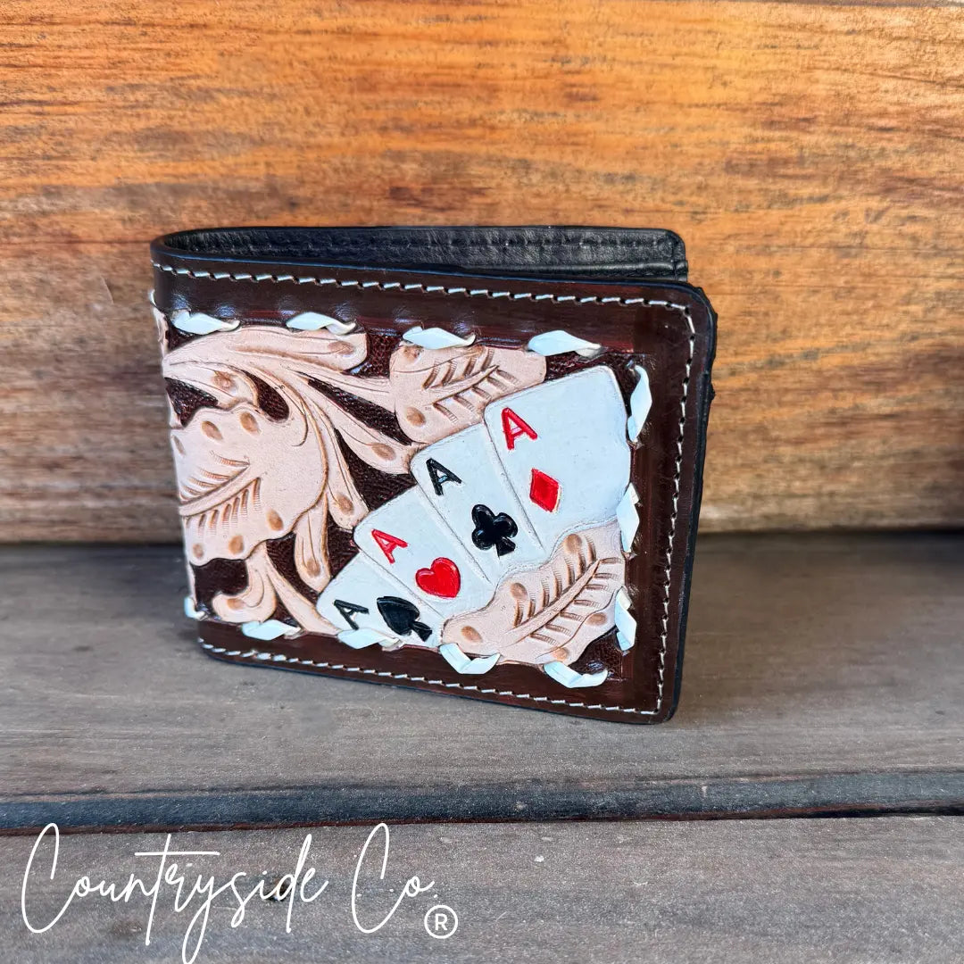 Brown leather men's wallet with hand-tooled design and painted aces.