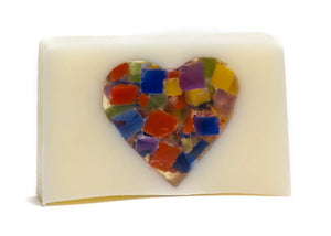 Creamy white bar soap with a mosaic heart embedded in the center.