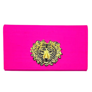 Hot pink clutch with gold lion emblem and magnetic snap closure