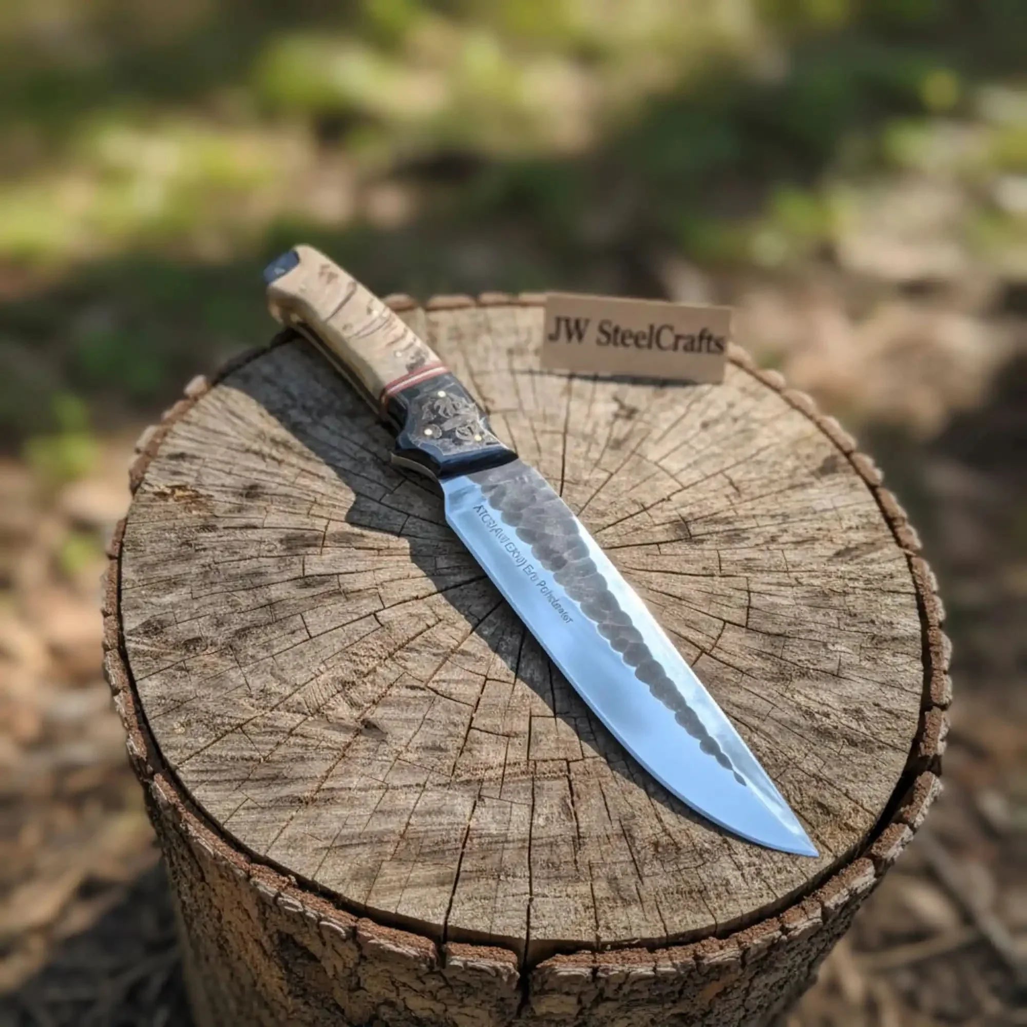 Handmade carbon steel steel knife with horn handle on dark surface