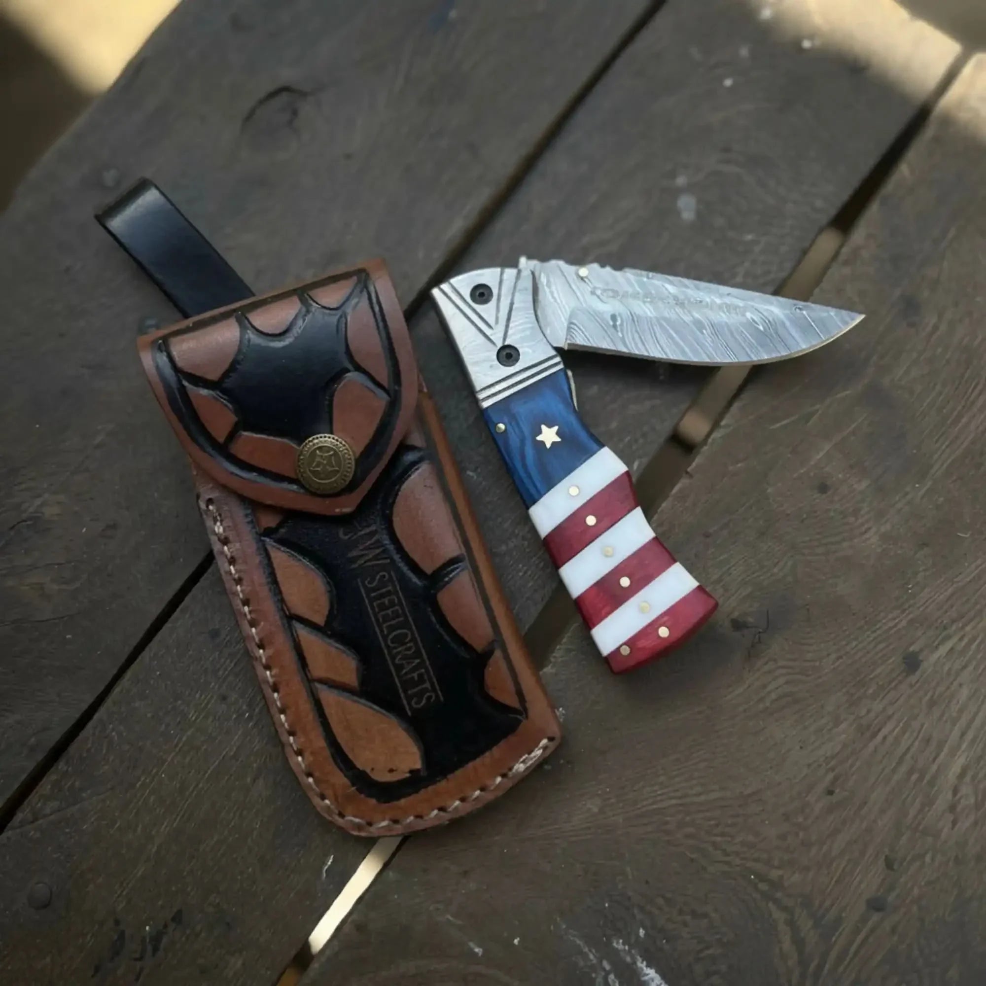 Damascus Folding Pocket Knife — American Flag Handle, Damascus Bolster, Linear Lock & Hand Engraved Leather Sheath by JW SteelCrafts