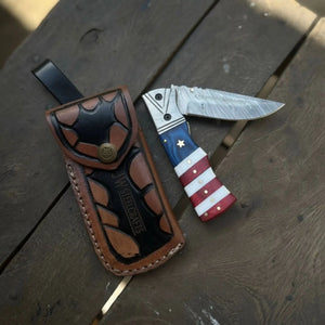 Damascus Folding Pocket Knife — American Flag Handle, Damascus Bolster, Linear Lock & Hand Engraved Leather Sheath by JW SteelCrafts