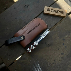 Damascus Folding Pocket Knife — American Flag Handle, Damascus Bolster, Linear Lock & Hand Engraved Leather Sheath