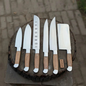 Handmade stainless steel steel knife with wood handle on dark surface
