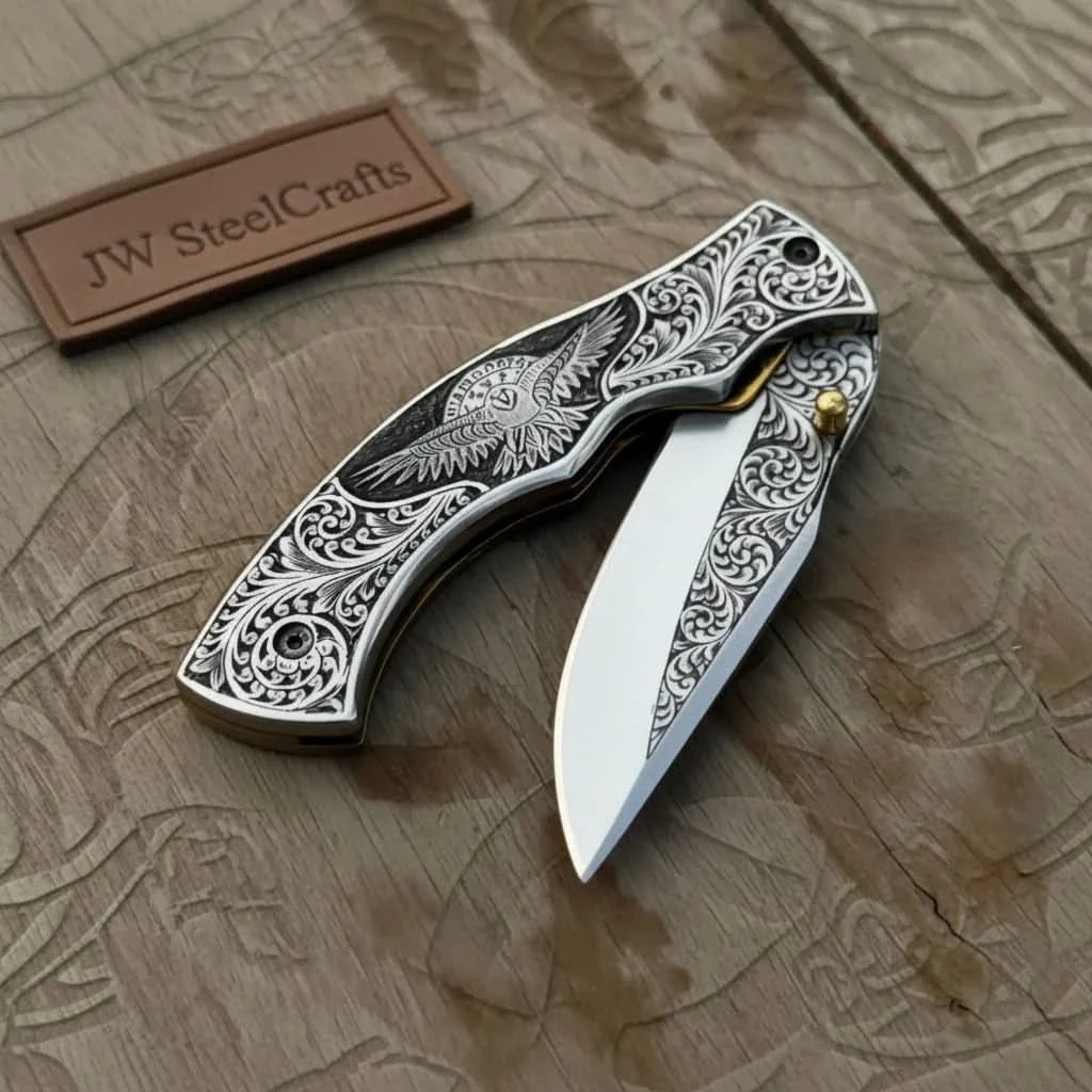 Hand Engraved Folding Knife — Eagle Motif Stainless Steel Scales, Mirror Polish Blade, Liner Lock, Wooden Box & Viking Rune Bracelet by JW SteelCrafts