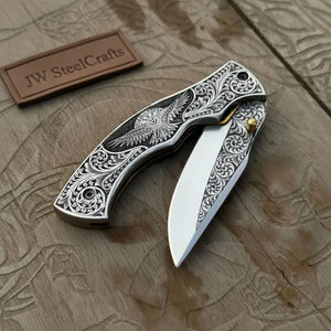 Hand Engraved Folding Knife — Eagle Motif Stainless Steel Scales, Mirror Polish Blade, Liner Lock, Wooden Box & Viking Rune Bracelet by JW SteelCrafts