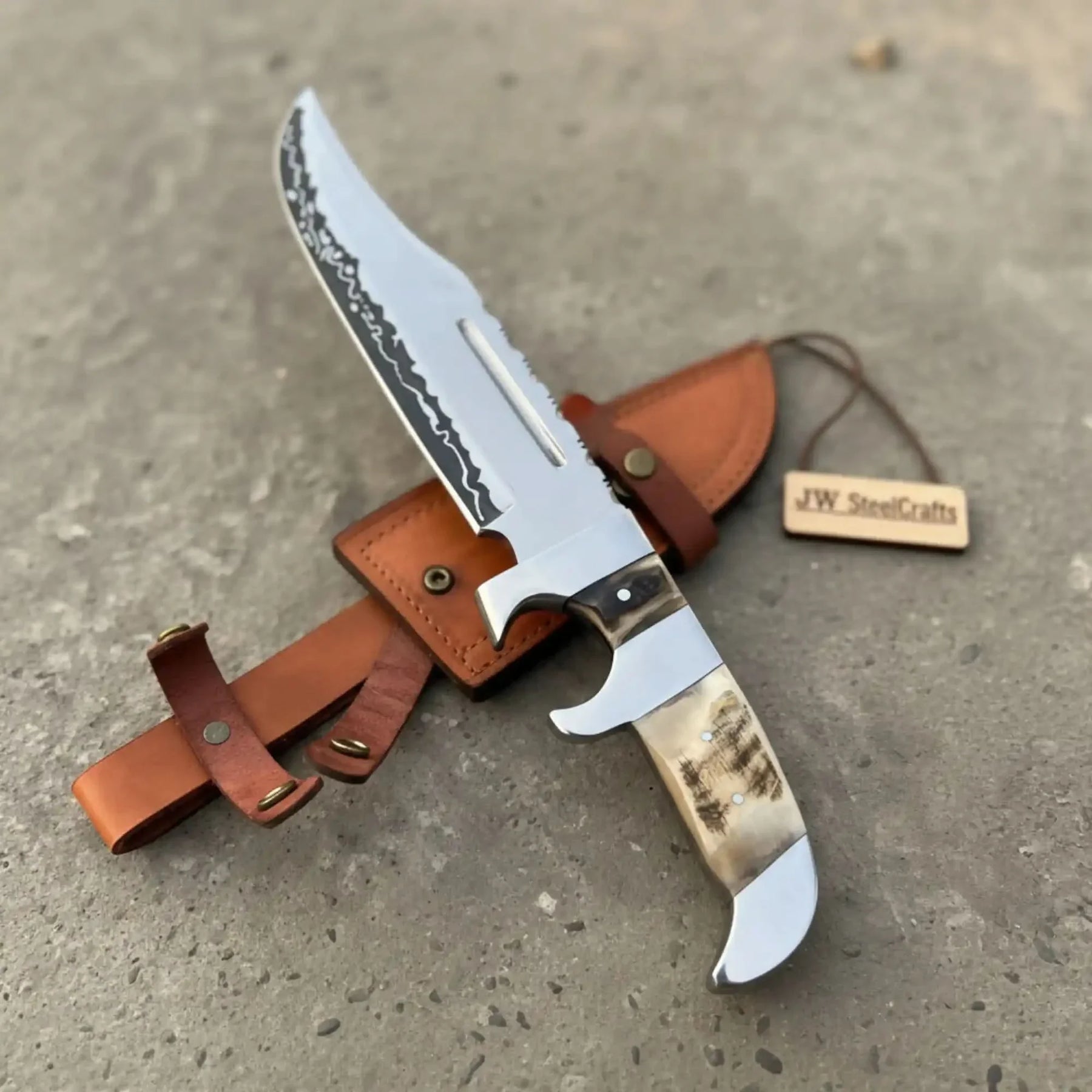 Handmade carbon steel steel knife with premium handle on dark surface