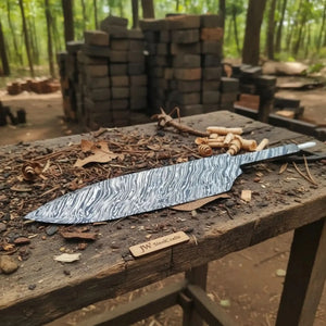 Handmade damascus steel knife with premium handle on dark surface