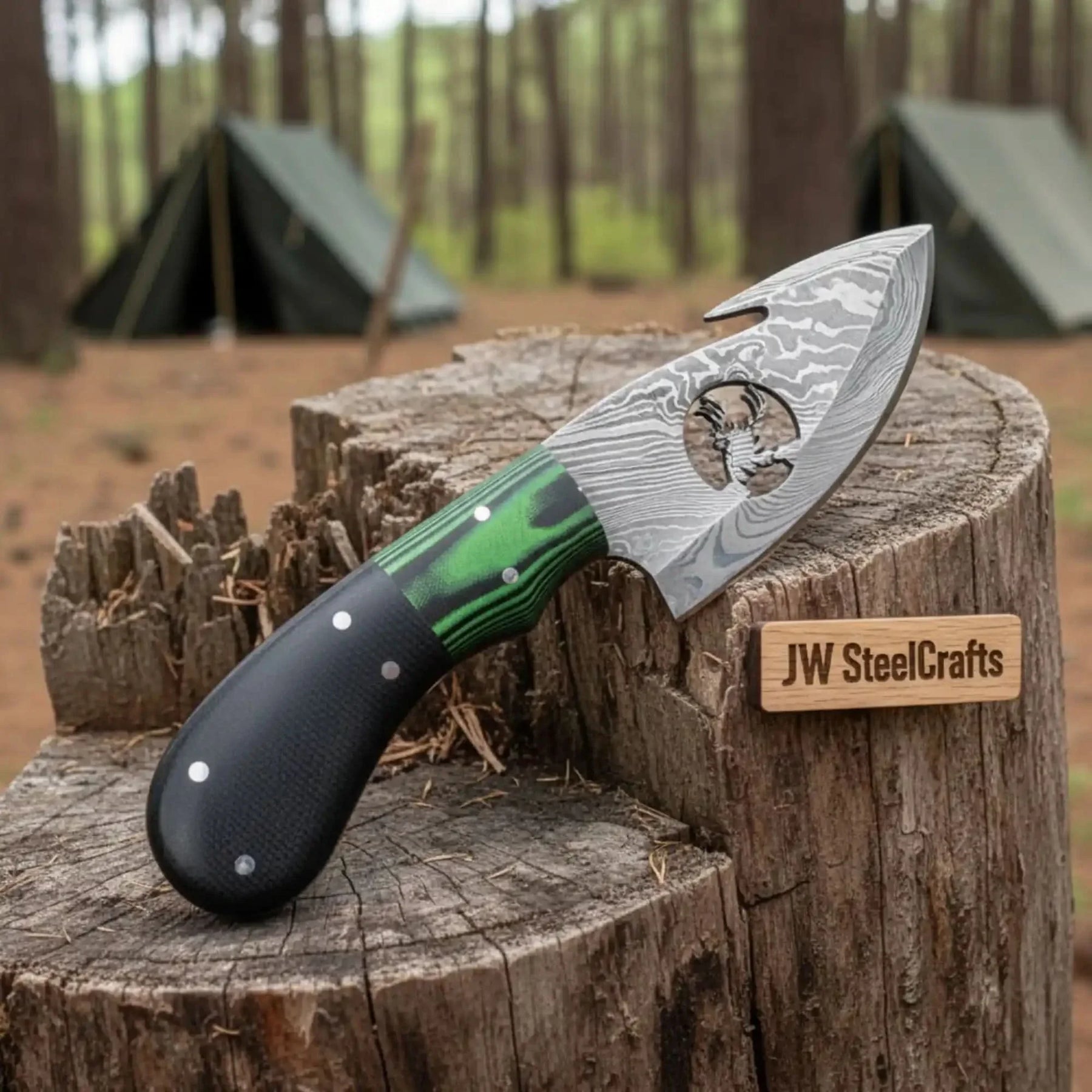 Handmade damascus steel knife with premium handle on dark surface