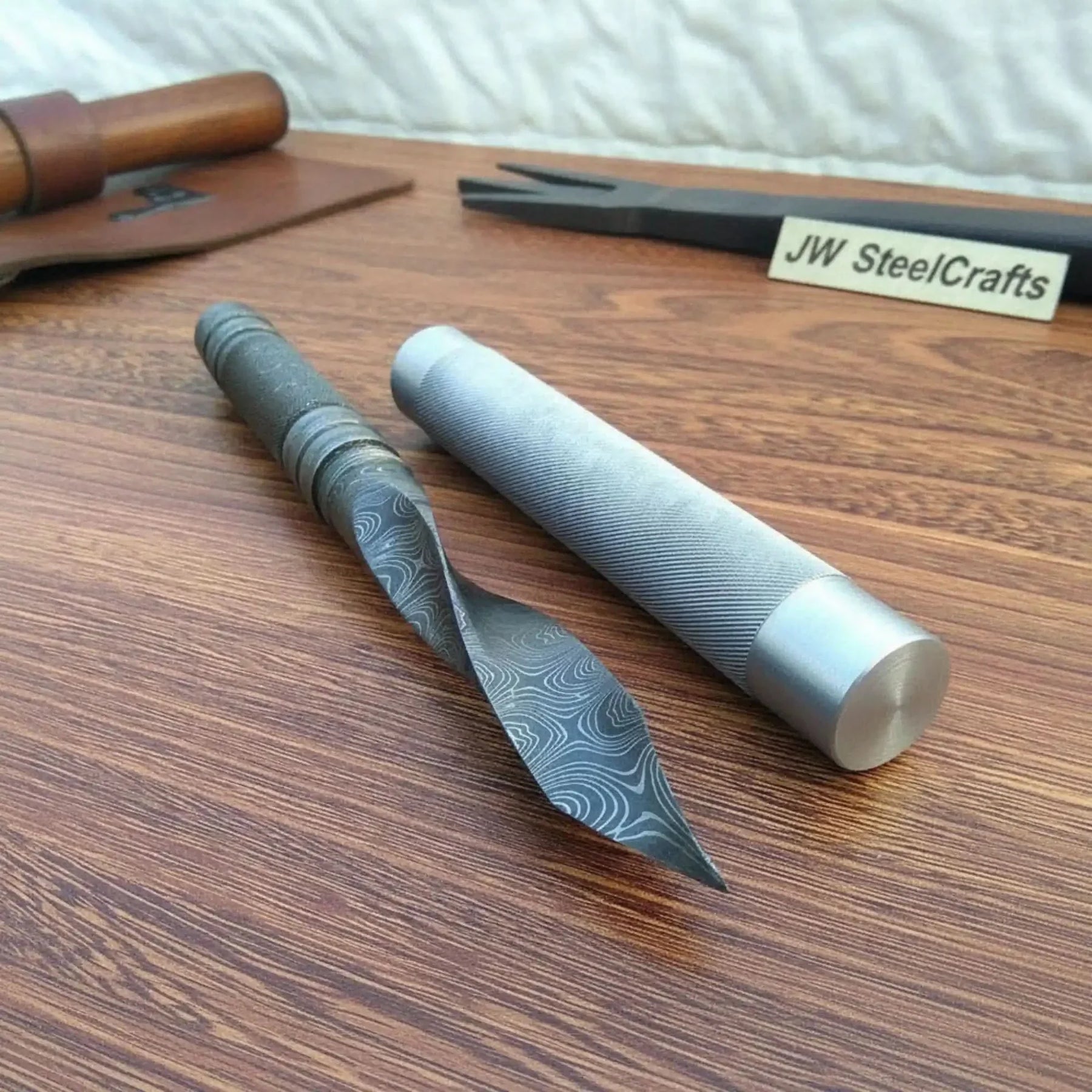 Handmade damascus steel knife with premium handle on dark surface