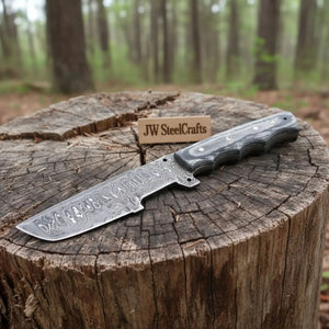 Handmade damascus steel knife with premium handle on dark surface