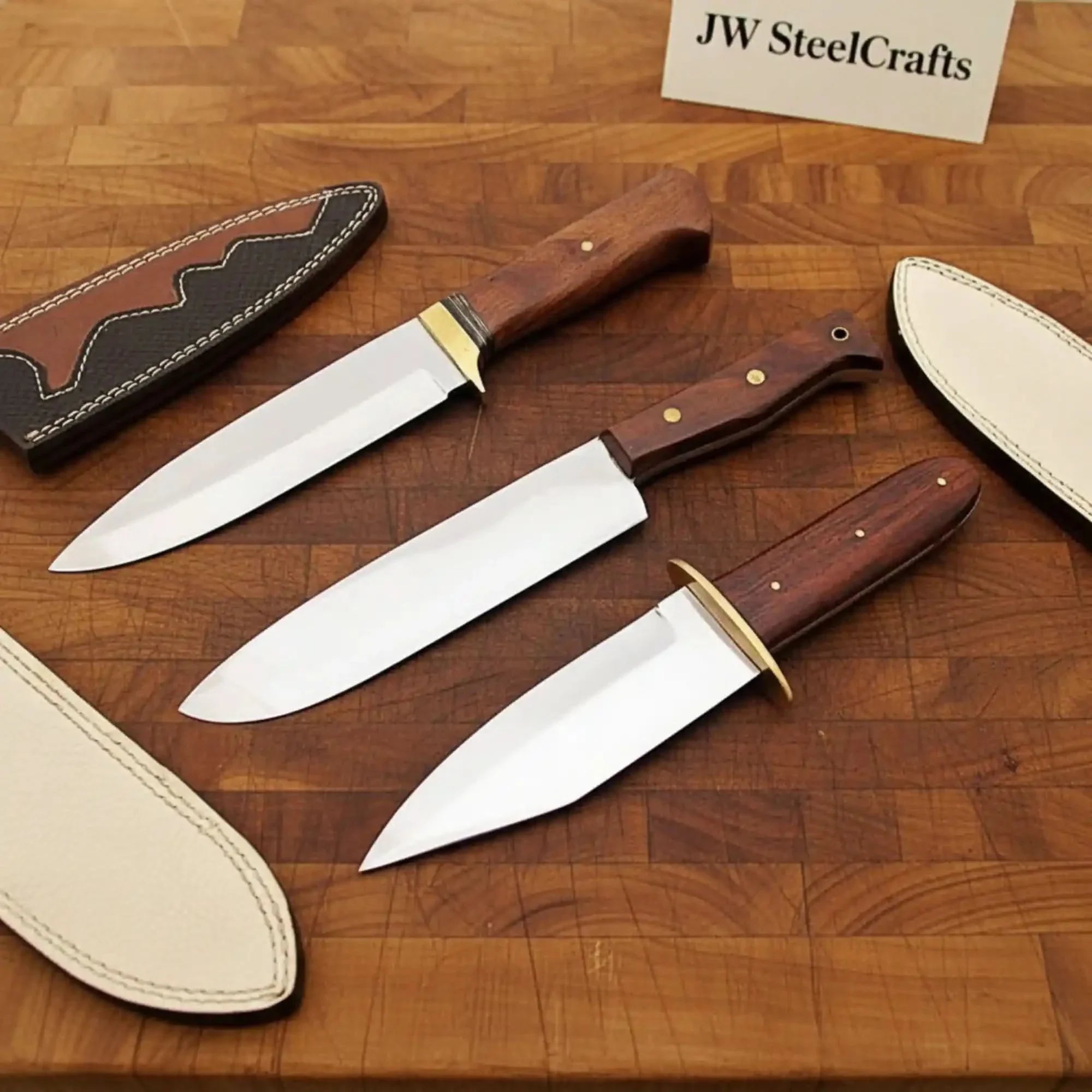 Handmade damascus steel knife with wood handle on dark surface
