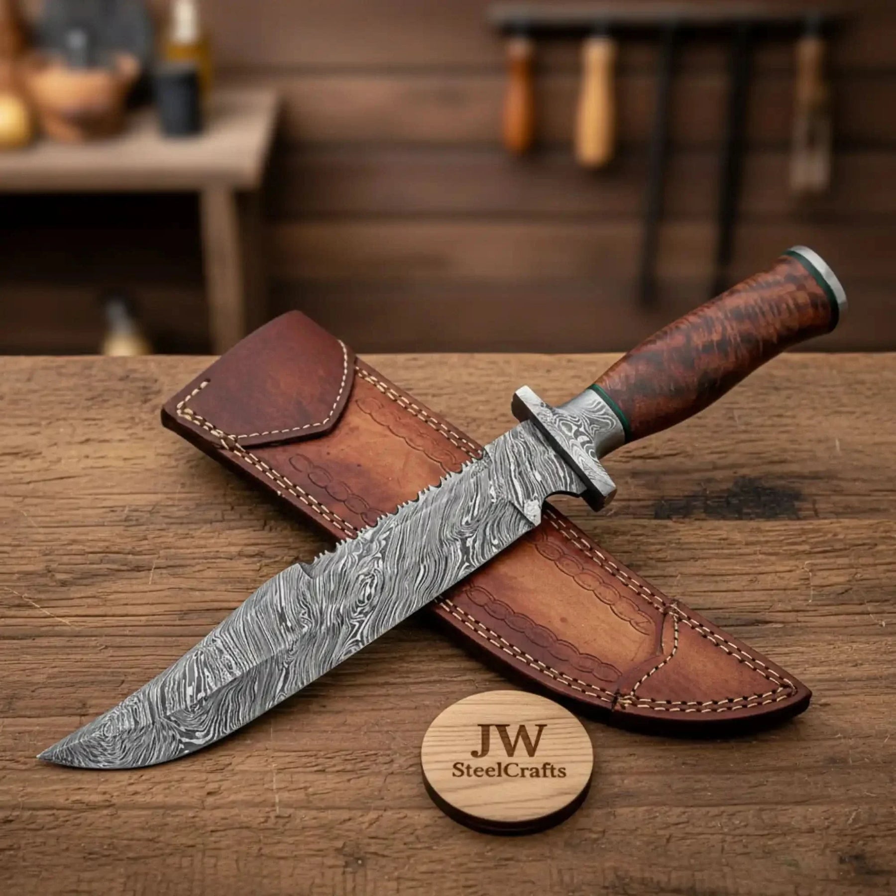 Handmade damascus steel knife with wood handle on dark surface