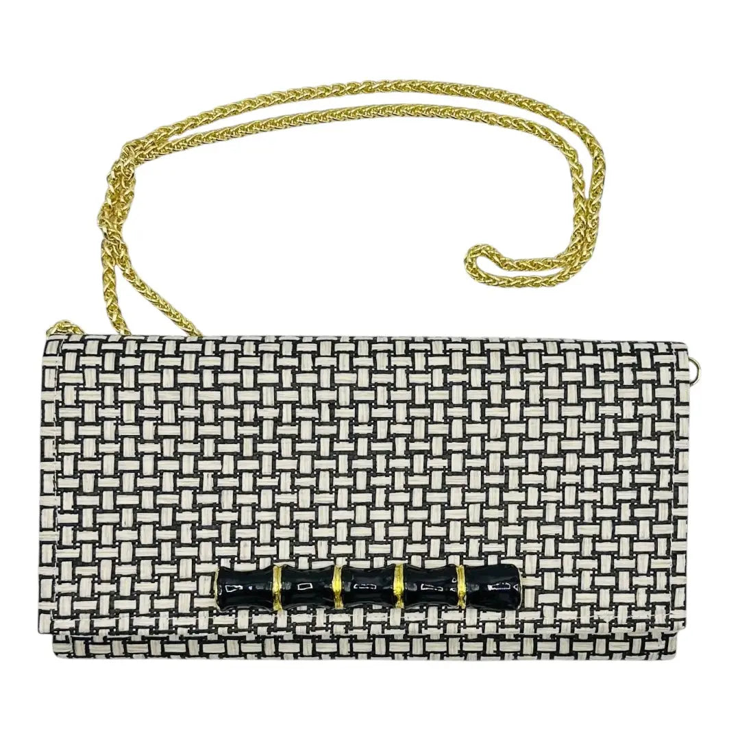 Jana Crossbody Clutch with black and white woven pattern and gold chain.