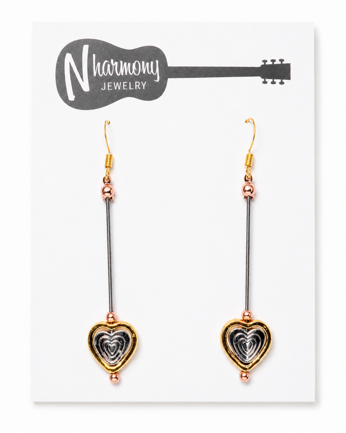 Heart-shaped earrings on a N'Harmony Jewelry card