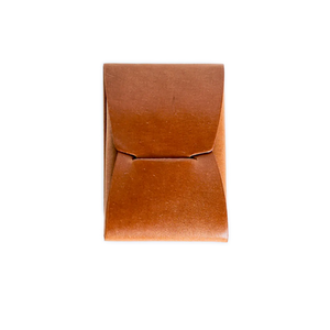 Brown leather card wallet, bi-fold design. Small, minimalist style.