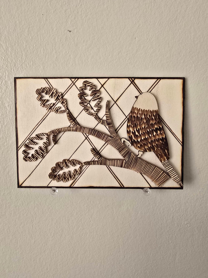 Bird on a branch laser etching