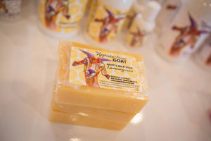 Stack of Lemongrass Goat Milk Soap slices with Essential Journeys label