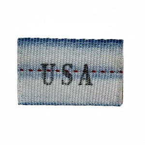 Woven fabric patch with blue, white, and red stripes, and black text that says 'USA'.