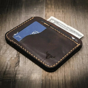 Brown leather minimalist wallet with card and cash slots.