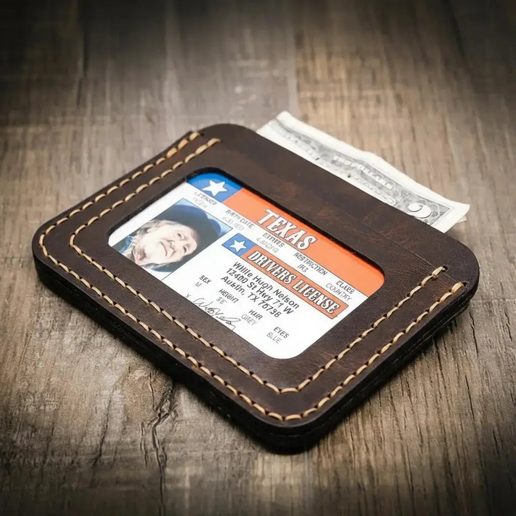 Brown leather minimalist wallet with Texas driver's license and cash.