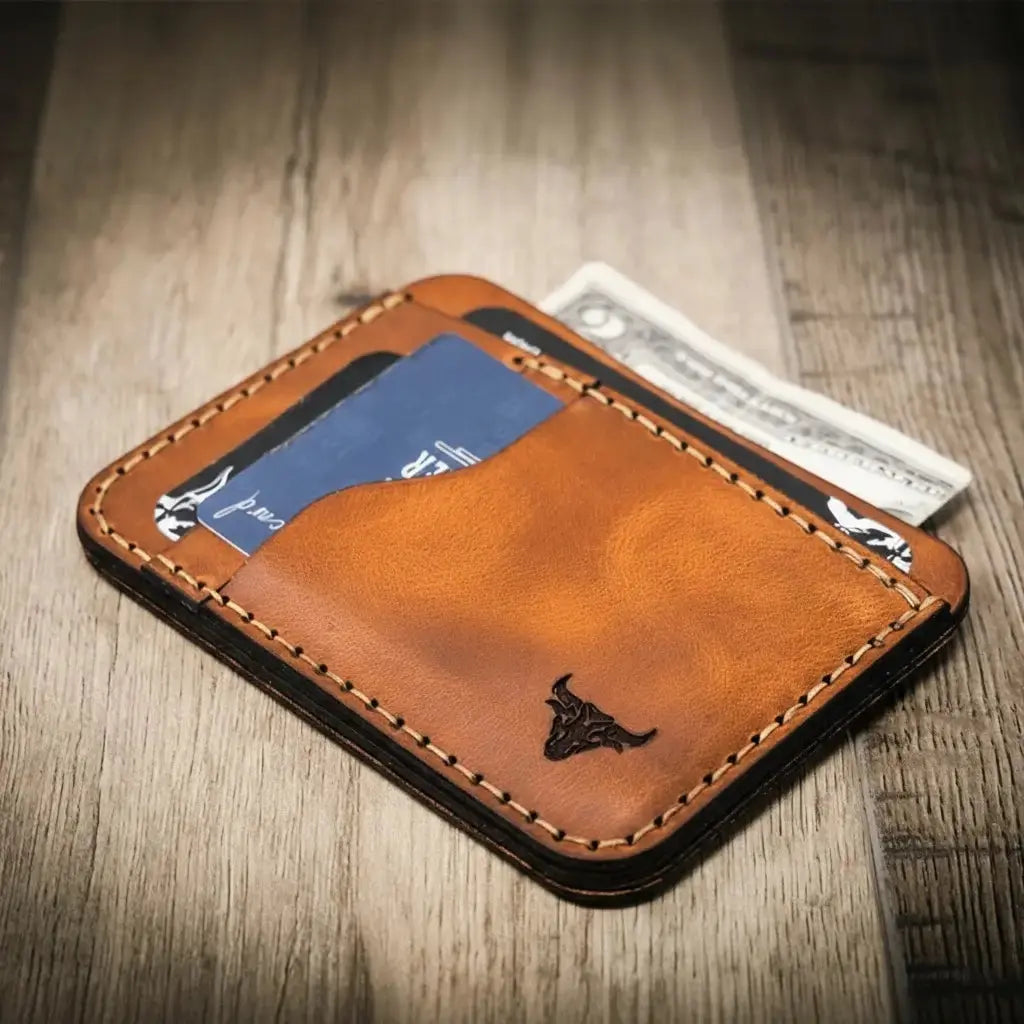 Brown full-grain leather minimalist wallet with card slots and bull logo.