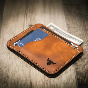 Brown full-grain leather minimalist wallet with card slots and bull logo.