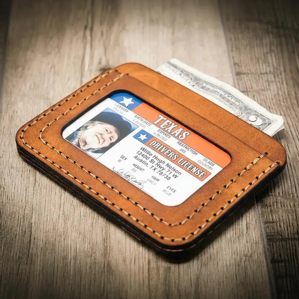 Brown leather wallet holding Texas ID and cash.