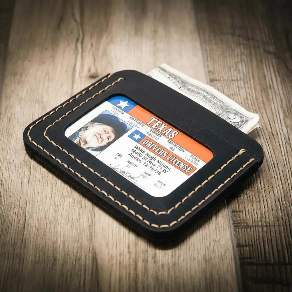 Black leather minimalist wallet with Texas driver's license and dollar bills.