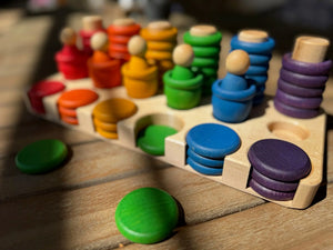 Maple sorting tray with colorful stacked discs for Grapat Carla.