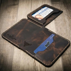 Brown leather bi-fold wallet with ID and card slots, featuring a badge slot and a bull logo.